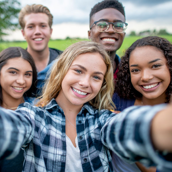group of teenage friends smiling