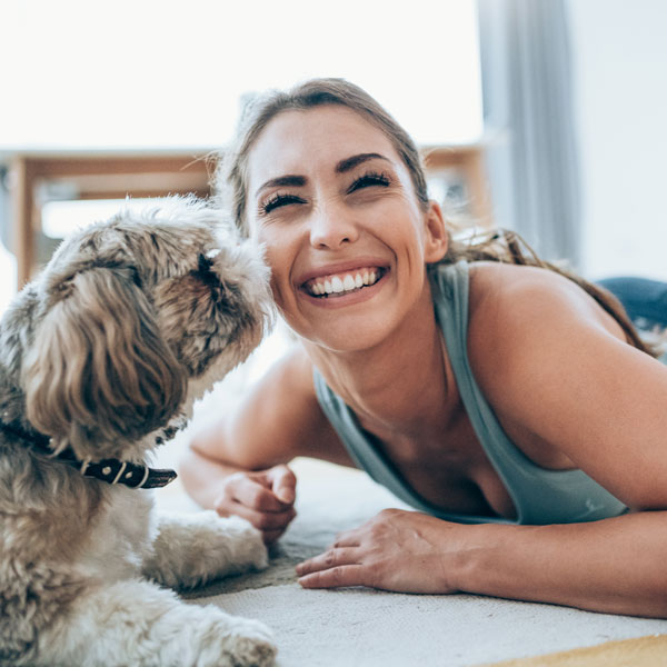 woman smiling with dog