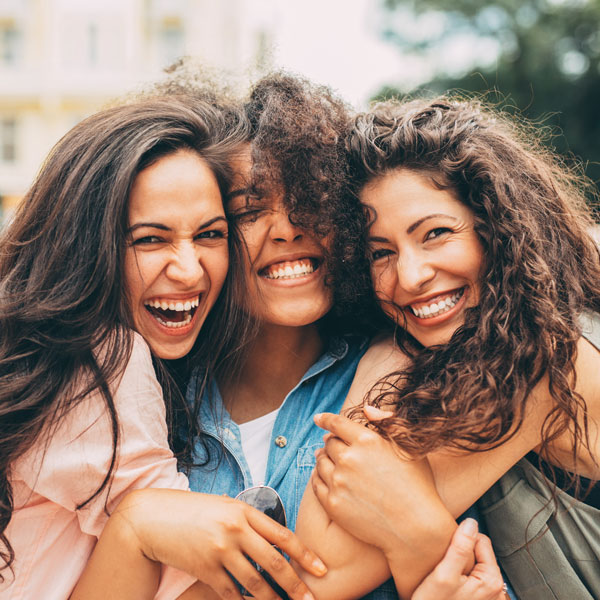friends laughing and hugging